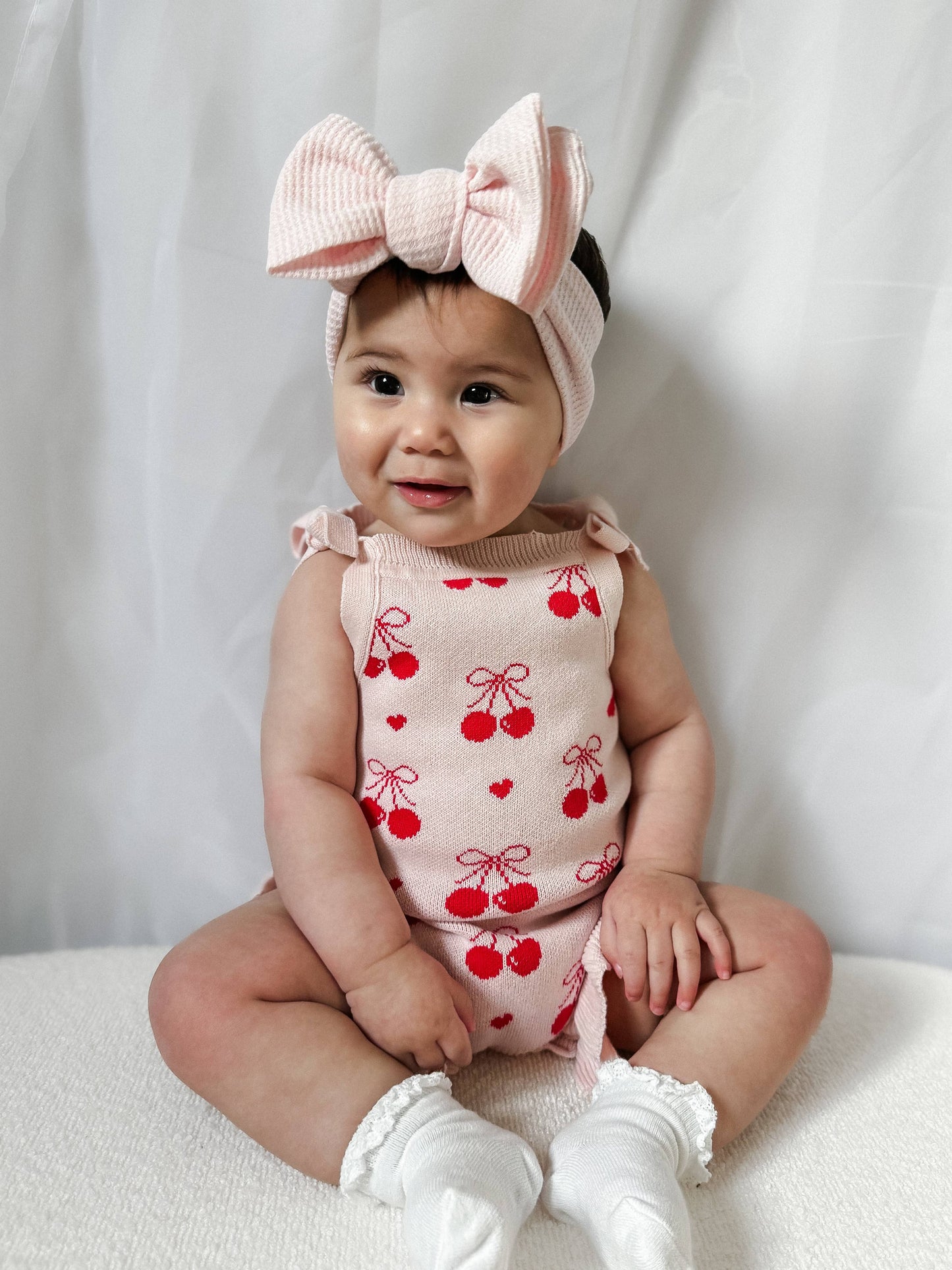 Petite + Co - Summer Cherry Heart Bow Frill Romper - Baby Pink
